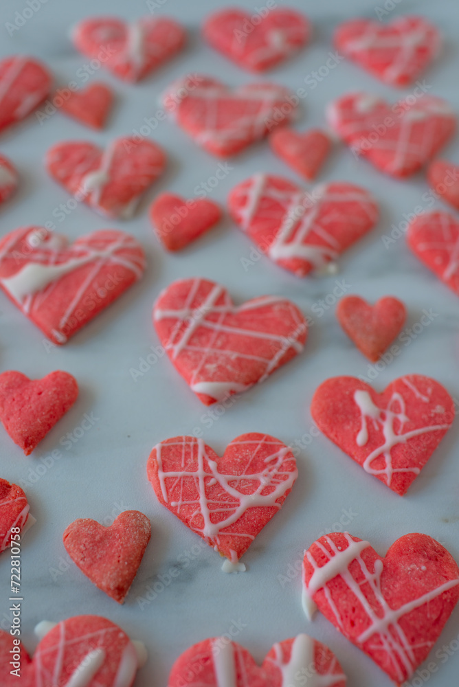 Fototapeta premium Heart shaped cookies with pink and white icing