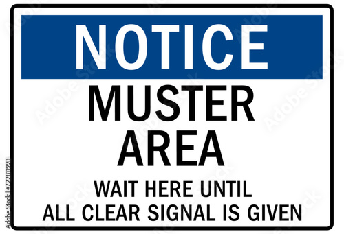 Muster area sign wait here until all clear signal is given photo