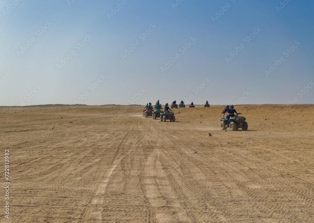 Tourists during quad safari in desert near Hurghada, Egypt.