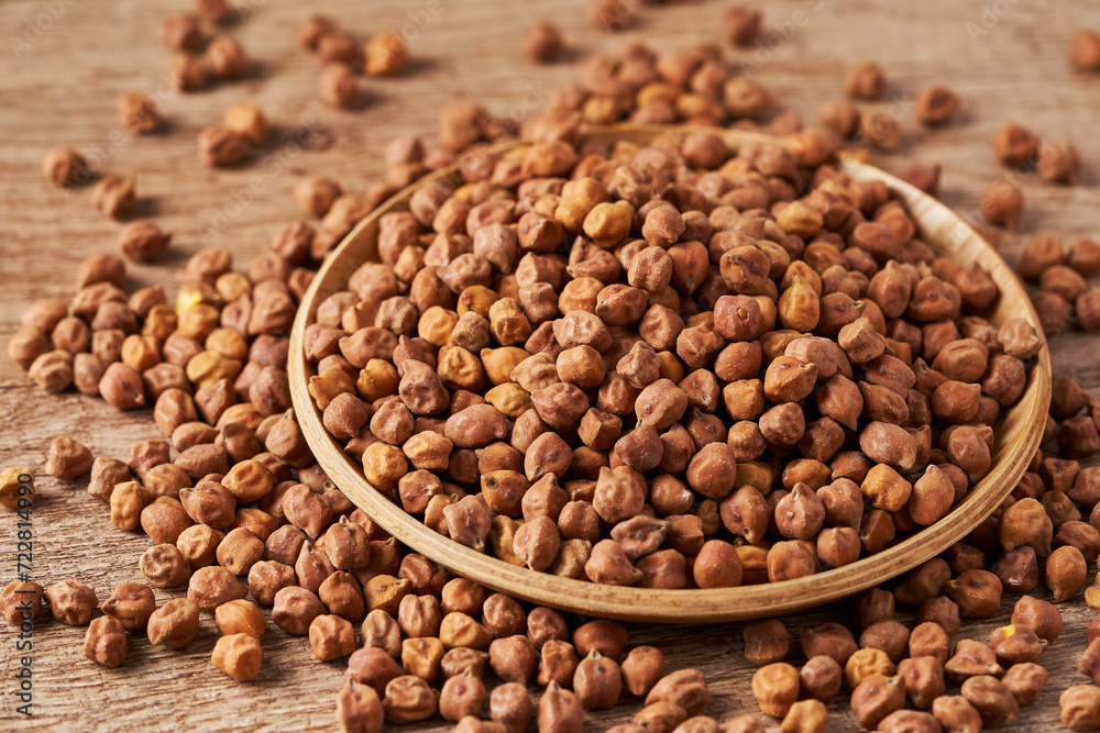 raw black chickpea chick pea legume kala chana in wood bowl on wooden table food rustic background raw black chickpea chick pea legume kala chana in wood bowl on wooden table food rustic background