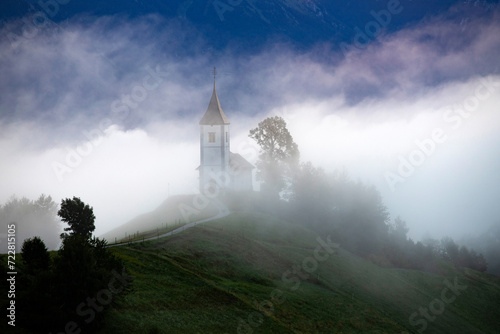 Jamnik, Slovenia - Magical foggy summer sunrise at Jamnik St.Primoz church.