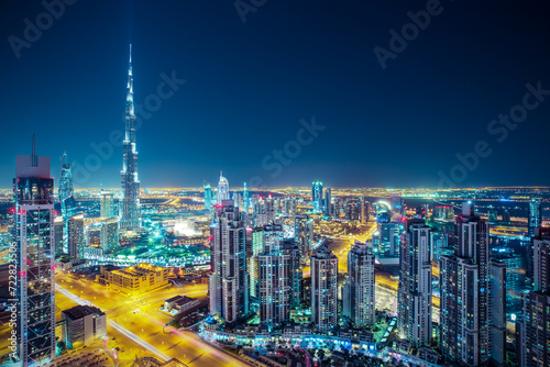 Fantastic nighttime skyline of a big modern city. Rooftop perspective of downtown Dubai, UAE.