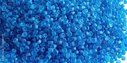  3d blue tiny plastic cylindrical grains , blue plastic polymer pellets,polymer for pipes, Plastic and polymer industry,blue PVC granulate.Microplastic products. photo