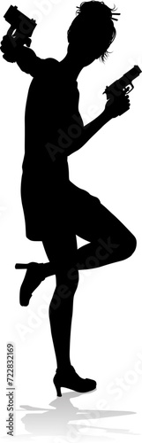 An action hero female movie star woman in silhouette. In a hitman, spy or secret agent detective type role halding a hand gun.