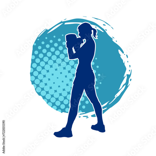 Silhouette of woman boxing athlete in action pose. Silhouette of a female wearing boxing gloves for boxing sport.
