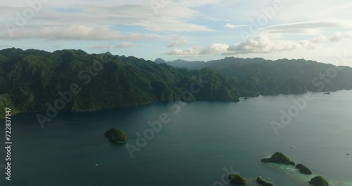 Banuang Daan and Siete Pecados with blue sea. Blue sky and clouds. Coron, Palawan, Philippines. photo