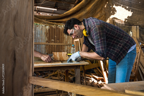 Caucasian carpenter man concentrate at work