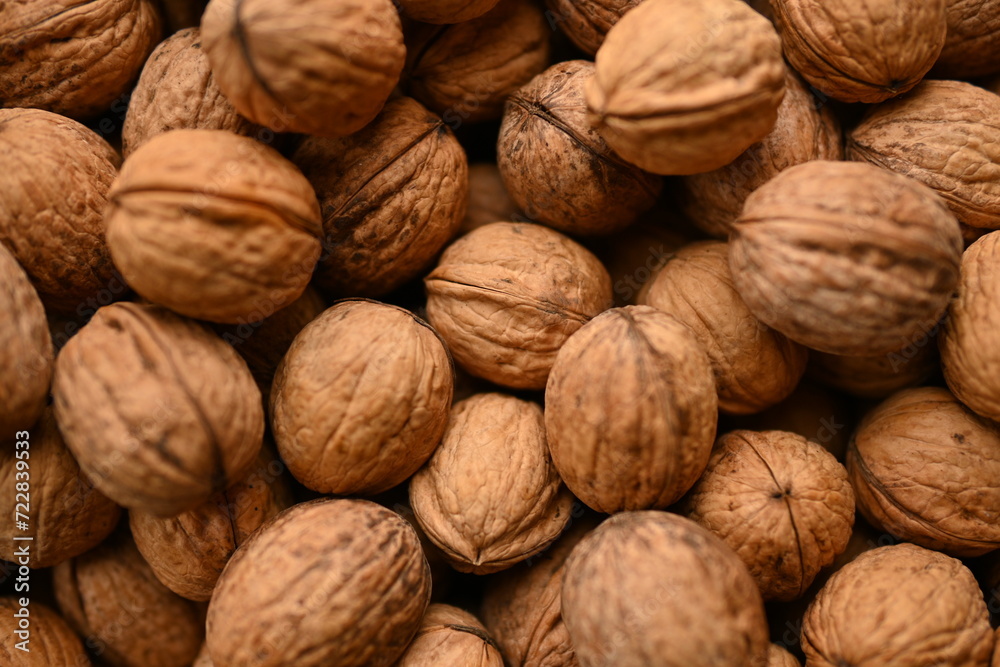 Top view of whole walnuts as background texture Top view of whole walnuts as background texture