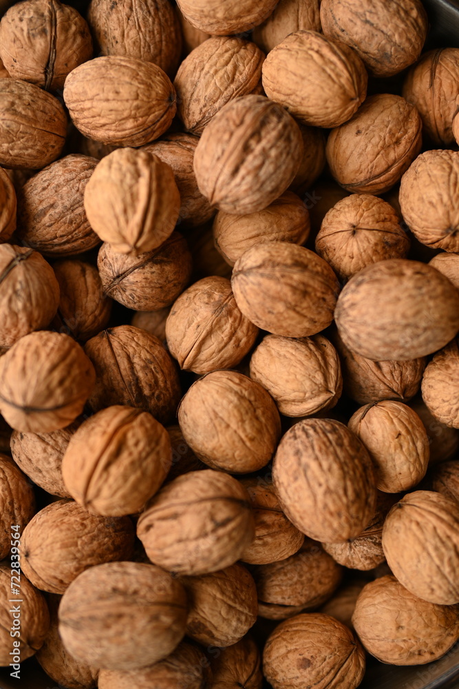 Top view of whole walnuts as background texture Top view of whole walnuts as background texture