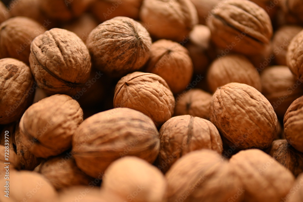 Top view of whole walnuts as background texture