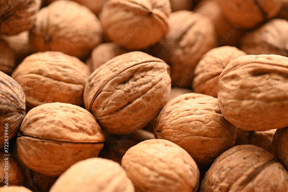 Top view of whole walnuts as background texture Top view of whole walnuts as background texture