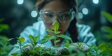 A Chinese woman scientist examines medicinal plants in a biological laboratory for pharmaceutical research.