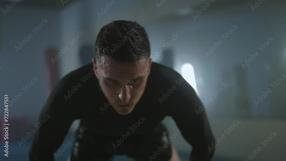 Portrait of a sporty fighter after a hard workout in the boxing gym, self-improvement.