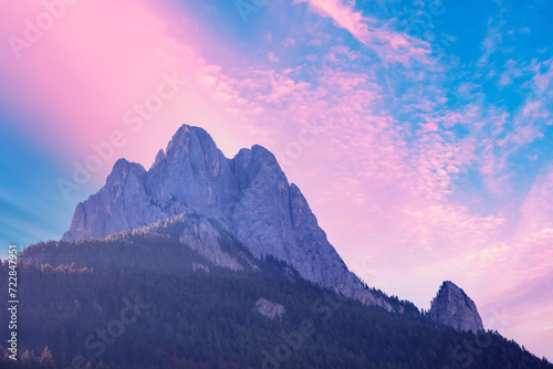 The Dolomites Alps against the sunset sky. View of Mountain ridge during sunrise in the Dolomites, South Tyrol, Italy