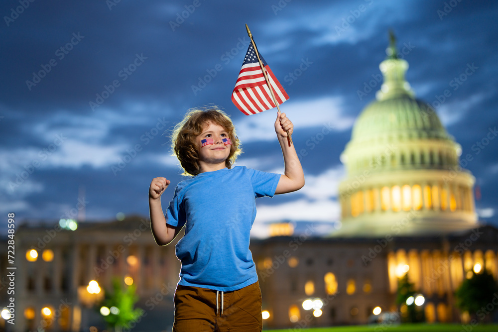 Child with American flag in Washington DC, capitol, congress building. American people celebrate 4th of July. American Kid hold the USA flag. Independence Day, American Flag Day.