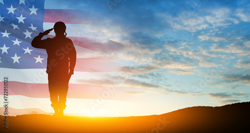 Silhouette of soldier saluting on background of USA flag. Greeting card for Veterans Day, Memorial Day. photo