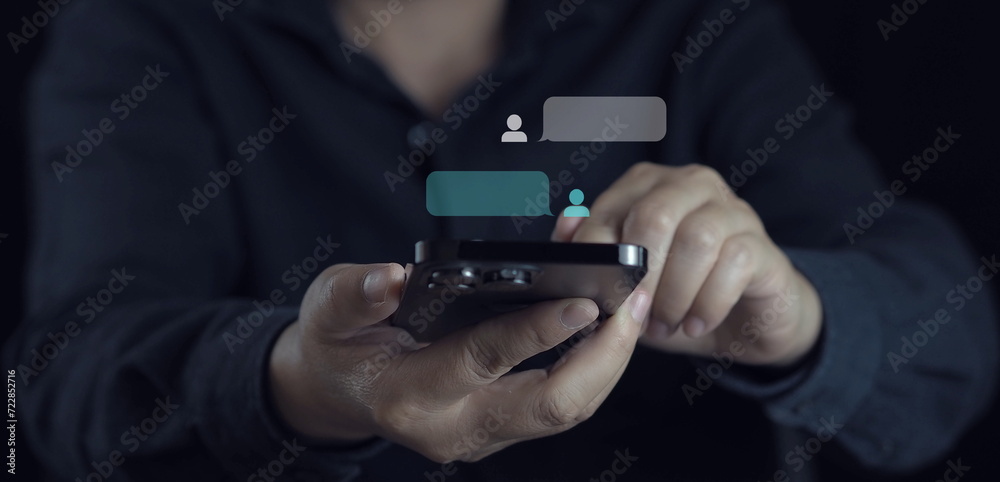 hand using smartphone typing Live chat chatting and social network concepts, chatting conversation working at home in chat box icons pop up. Social media marketing technology concept. hand using smartphone typing Live chat chatting and social network concepts, chatting conversation working at home in chat box icons pop up. Social media marketing technology concept.