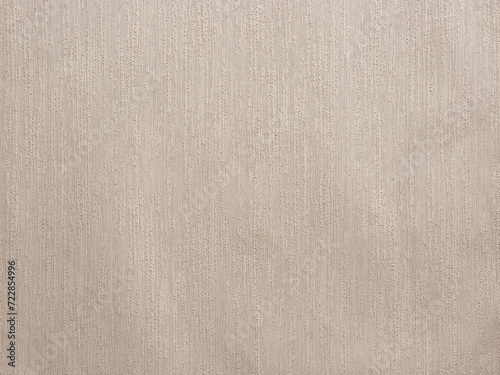 Abstract pastel beige plaster wall background or backdrop with vertical stripes.