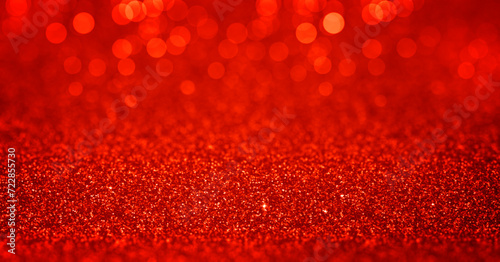 Sparkling red gold glitter background with bokeh, dof. February 14th valentines day backdrop. Pattern with shining fine red sequins. Festive luxury background, backdrop, texture. Design element