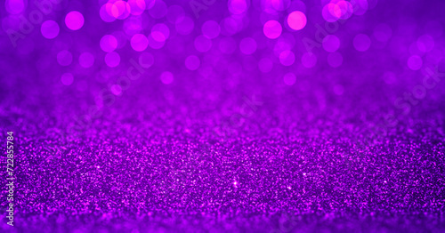 Sparkling purple magenta glitter background with bokeh. Closeup view, dof. Pattern with shining fine purple sequins. Festive luxury magenta background, backdrop, texture. Design element