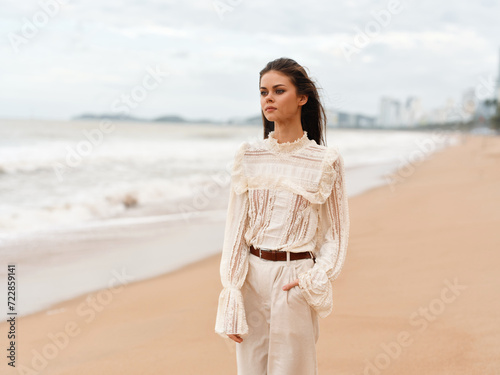 Attractive Female Enjoying Sunny Beach Walk: Beauty, Relaxation, and Freedom Amidst Tropical Nature.