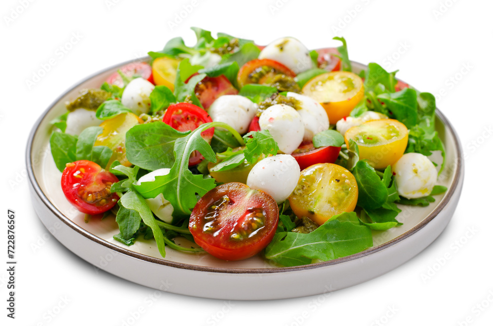 Caprese Salad with Cherry Tomatoes and Pesto Sauce on White Background Caprese Salad with Cherry Tomatoes and Pesto Sauce on White Background