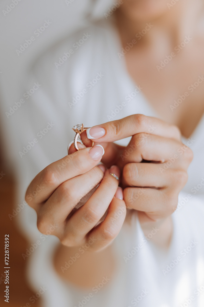 tender hands of a young woman with an expensive ring and a beautiful manicure. Close-up photo of female hands tender hands of a young woman with an expensive ring and a beautiful manicure. Close-up photo of female hands