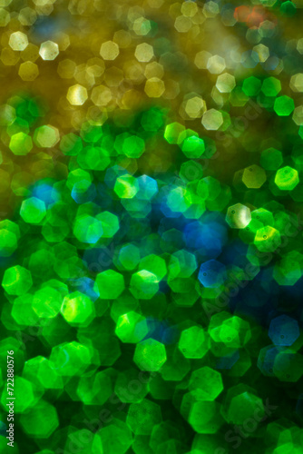 Abstract bokeh background of glowing lights in soft focus. Glitter backgrounds. Light bokeh to design. Glitter backgrounds for valentines day, birthday or Christmas cards. Abstract glitter background.