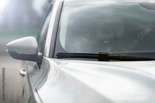 window broken by a stone in the car - insurance - road accident - broken glass