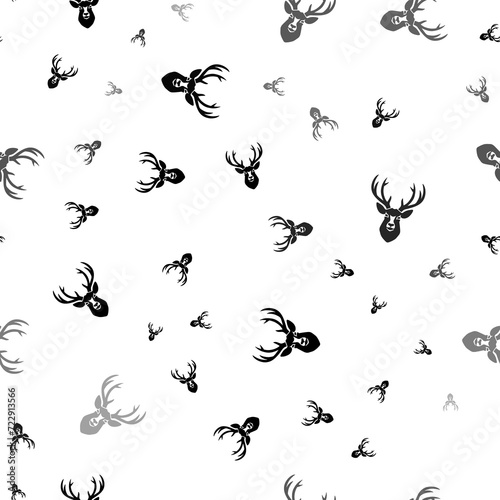 Seamless vector pattern with deer head symbols, creating a creative monochrome background with rotated elements. Illustration on transparent background © Alexey