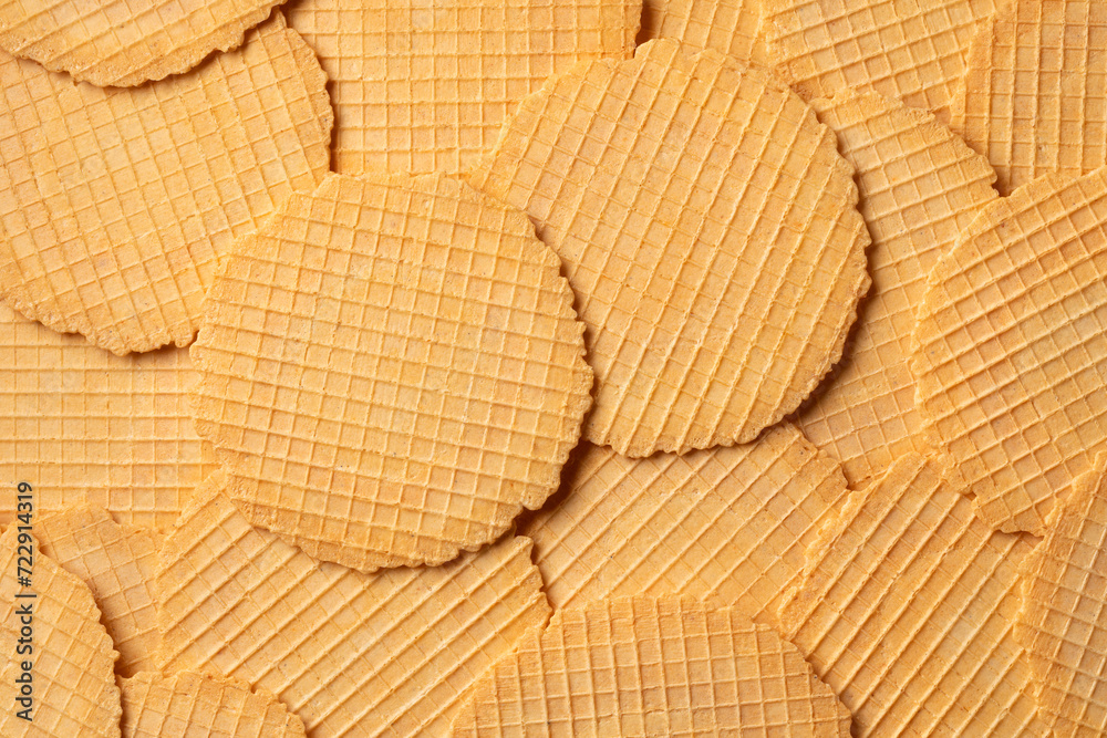 Fototapeta premium Fresh homemade baked thin cheese waffles full frame close up as background