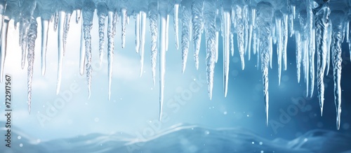 Icicles hanging from roof of house Winter concept Closeup danger icicles Frozen climate pattern Frost winter season. Creative Banner. Copyspace image