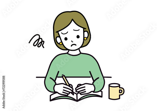 困った顔で勉強する女性