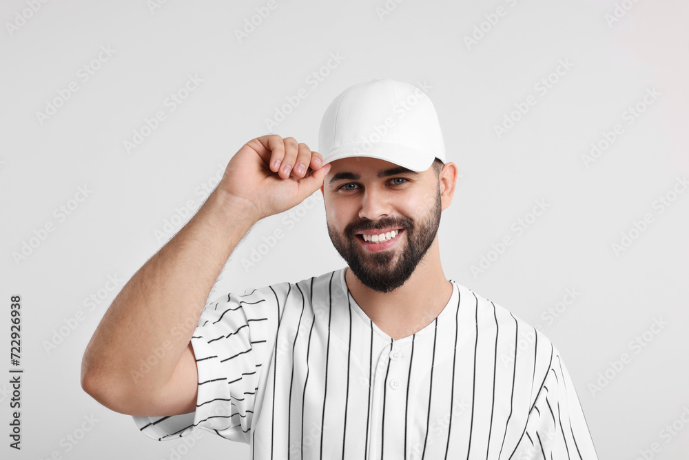 Man in stylish baseball cap on white background Man in stylish baseball cap on white background