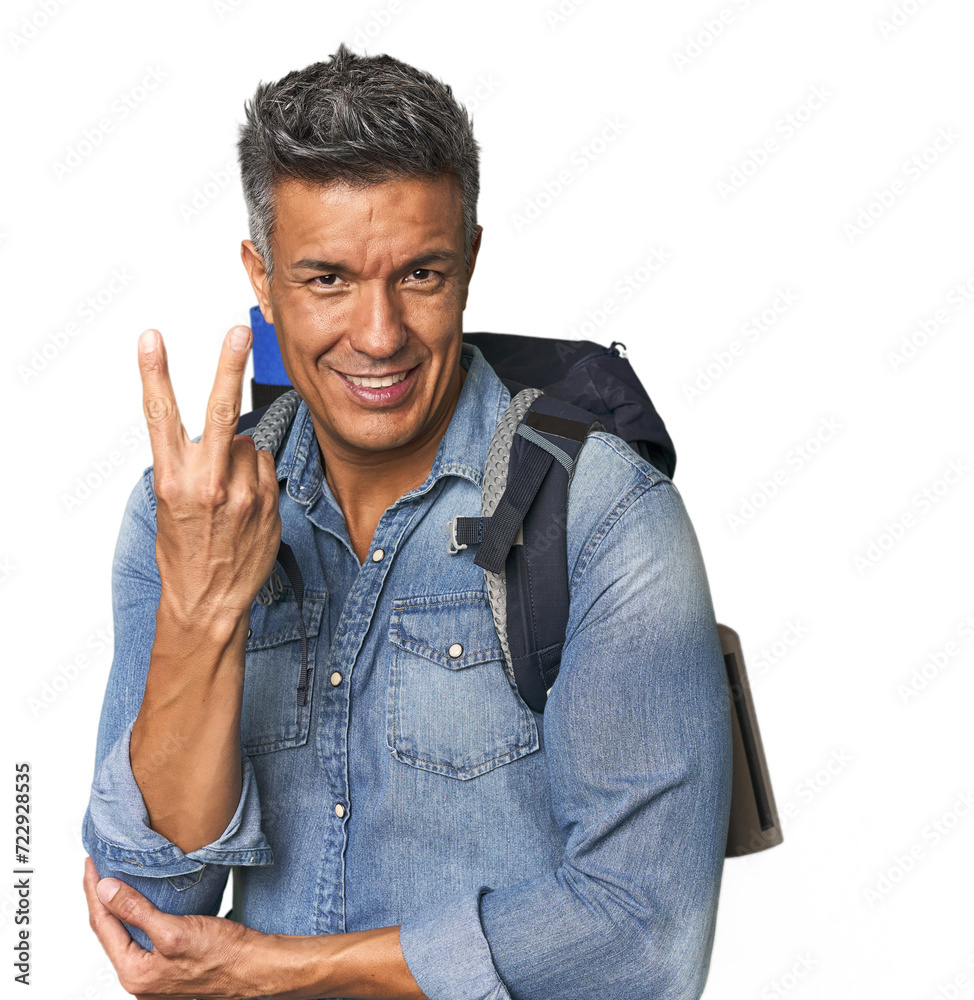 Hispanic hiker with backpack and flask showing number two with fingers. Hispanic hiker with backpack and flask showing number two with fingers.