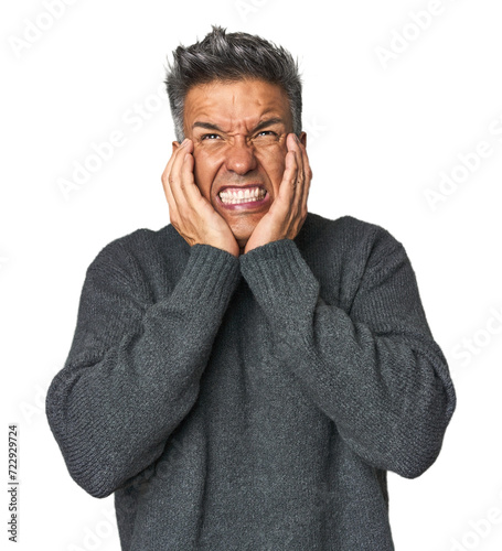 Obraz na płótnie Middle-aged Latino man whining and crying disconsolately.