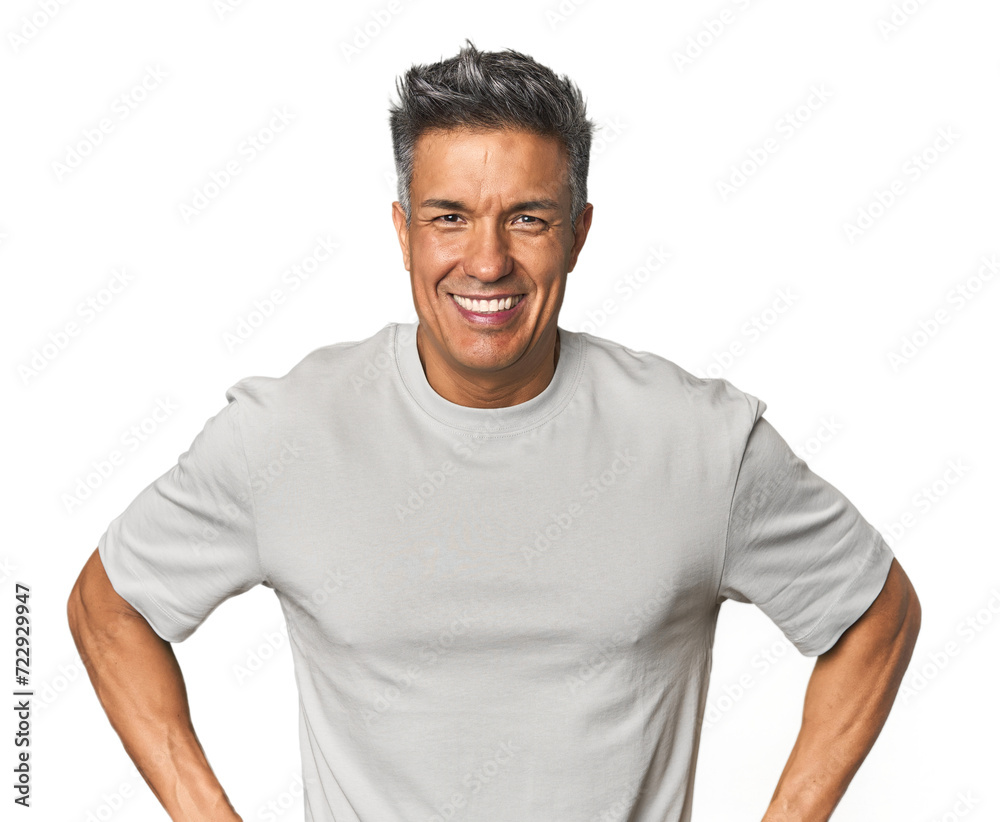Middle-aged Latino man confident keeping hands on hips. Middle-aged Latino man confident keeping hands on hips.