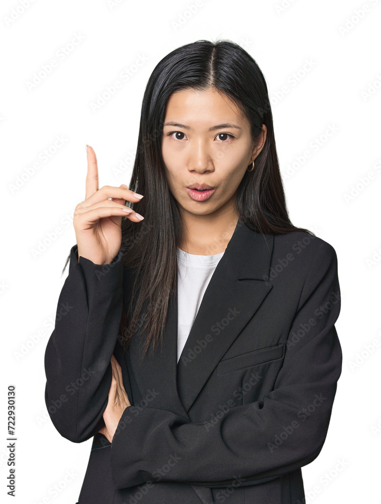 Young Chinese woman in business suit having some great idea, concept of creativity. Young Chinese woman in business suit having some great idea, concept of creativity.