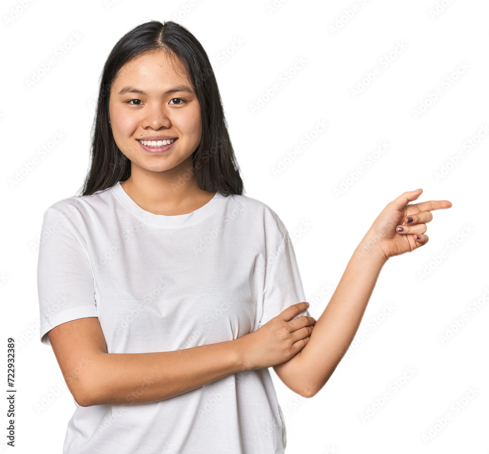 Young chinese woman isolated smiling cheerfully pointing with forefinger away. Young chinese woman isolated smiling cheerfully pointing with forefinger away.