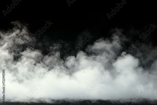 White smoke or steam from dry ice on a black background. White cloud of vapor. Texture of fog or smoke.