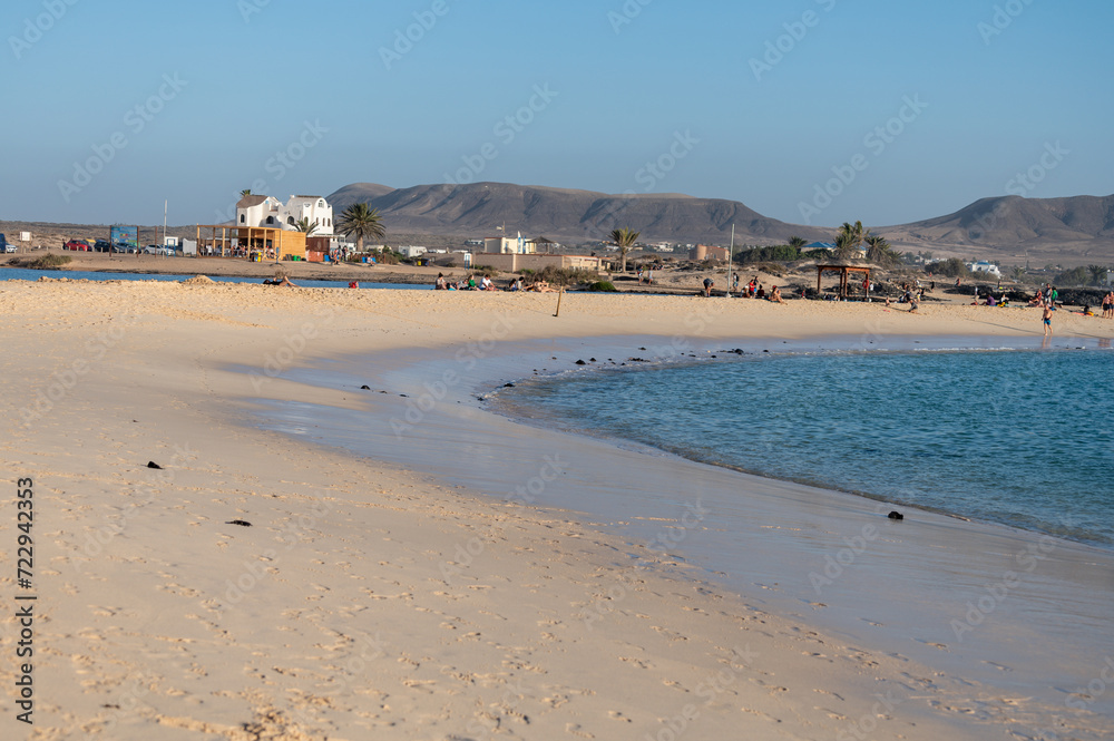 West coast of Fuerteventura island. Winter sea and sun vacation in El Cotillo touristic village, Canary islands, Spain. White sandy beach La Concha..