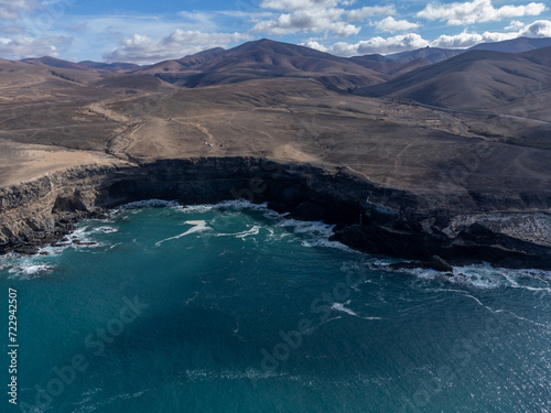 West coast of Fuerteventura island. View on blue water and black caves of Ajuy village, Canary islands, Spain.