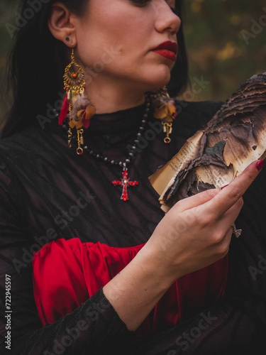 witch in the forest with books, burning fire, fire, witchcore, greenwitch, book on fire, ashes