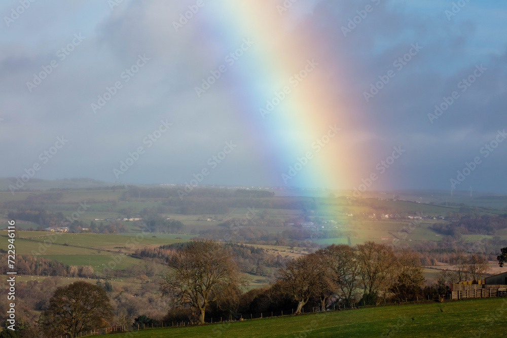 Rainbow over farmland and fields in County Durham, England, UK. Rainbow over farmland and fields in County Durham, England, UK.