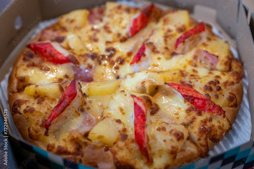 The hand of a woman with a pizza The hand of a woman with a pizza