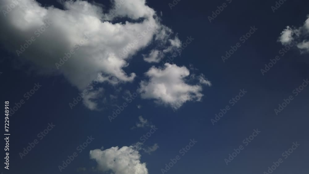 Lonely cirrus clouds in the blue sky