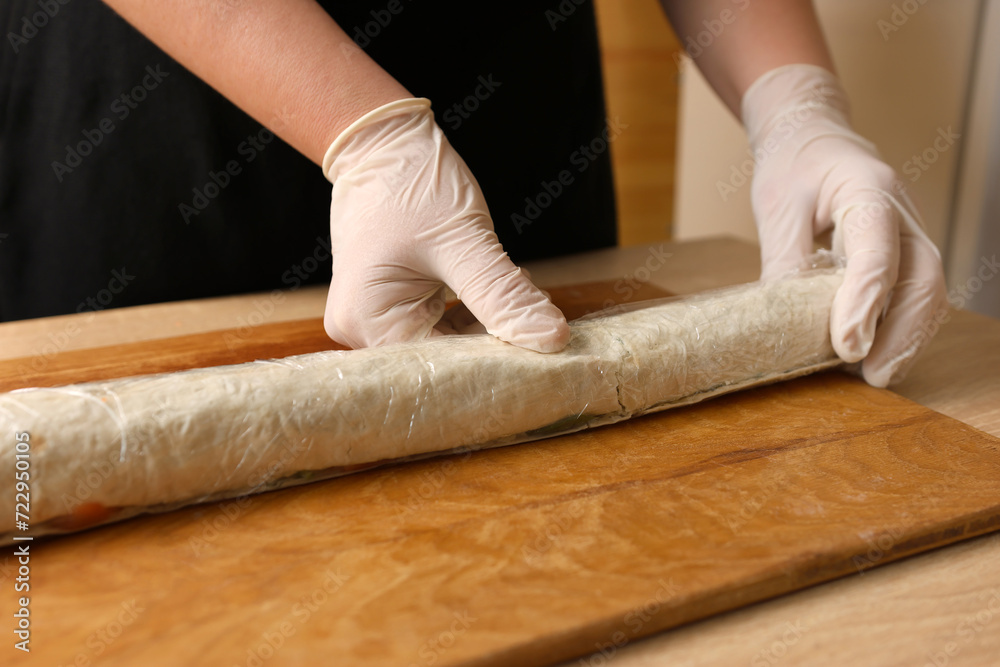 For storage, the pita roll is wrapped in cling film For storage, the pita roll is wrapped in cling film