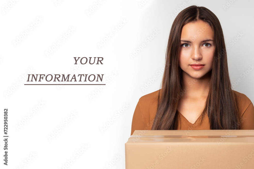 interesting composition. A young girl stands on a white background with a box in her hands, next to it is the inscription your information, creative concept interesting composition. A young girl stands on a white background with a box in her hands, next to it is the inscription your information, creative concept