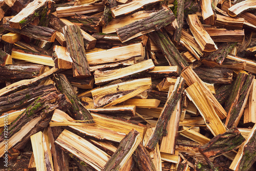 Foto Stacked dry firewood as a background