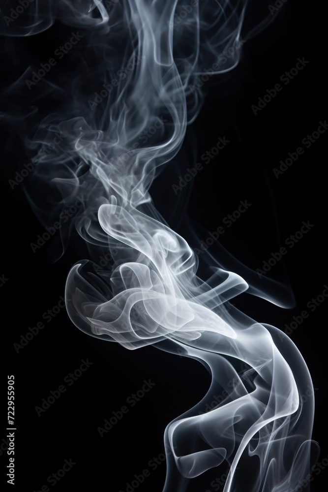 Close-up view of smoke on a black background. Can be used for creative projects or as a background image. Close-up view of smoke on a black background. Can be used for creative projects or as a background image.